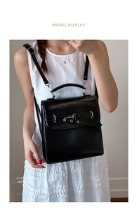 Fashionable black leather square backpack shown on a model with a white dress