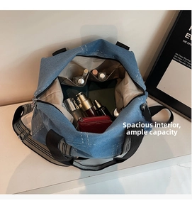 Top view of spacious denim tote interior with multiple pockets and daily essentials