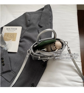 Top view of silver mini square bag showing interior storage for phone and umbrella