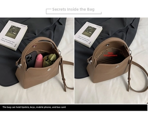 Détail de l'intérieur du sac à main en cuir marron montrant la capacité et le fermoir