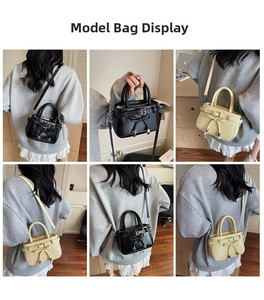 Detail view of stylish crossbody bucket bags in black and beige with bow charms
