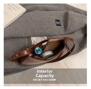 Internal storage capacity of brown leather crossbody bag with daily essentials inside