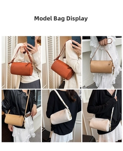 Detailansicht gewebter zylindrischer Boston-Taschen in Braun und Beige mit Trageriemen