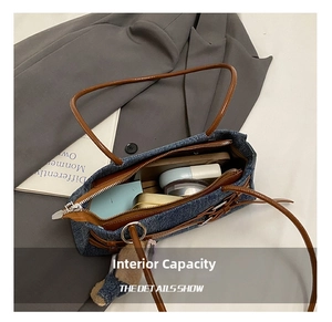 Blue denim tote interior showing capacity for cosmetics and a phone with a teddy charm