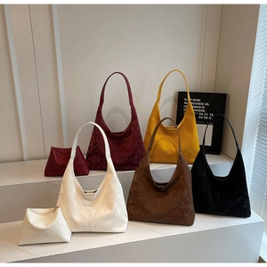 Detailed collection of five suede tote bags in various trendy seasonal colors and matching pouches
