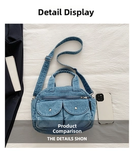 Detail view of denim crossbody bag showing multi-pocket design and adjustable strap