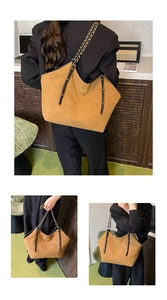 Macro detail of khaki suede tote bag with diamond stitching and metal chain strap