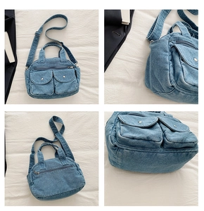 Detail view of denim crossbody bag with dual pockets, top handles, and adjustable strap