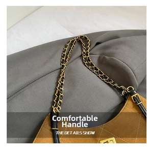 Detail of diamond-quilted brown suede tote with gold chain strap and metal buckle