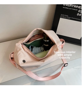 Pink travel bag interior showing large capacity for wallet, umbrella, and skincare products