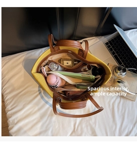 Top view of yellow canvas tote bag showing spacious interior with organized essentials
