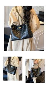 Quilted tote bag detail with gold chain strap and metal swivel lock on black material