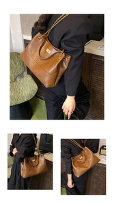 Detail of quilted brown tote bag with gold chain strap and metal turn-lock closure