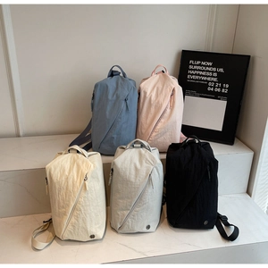 Lightweight nylon crossbody bags in five colors with unique diagonal zipper and crinkle texture