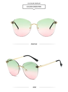 Detail of rimless gradient sunglasses featuring golden metal leopard head hinge decor