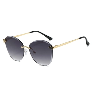 Rimless gradient ocean sunglasses with golden metal leopard head decor and black temple tips