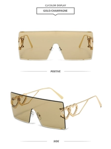 Detail of rimless champagne sunglasses with double heart-shaped hollow metal temples