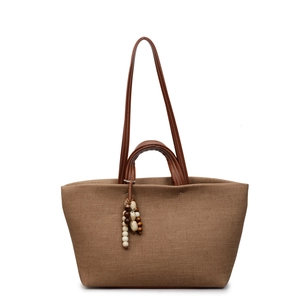 Brown canvas large capacity tote bag with leather straps and decorative beads