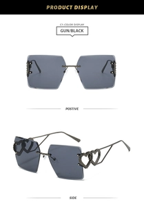 Detail of rimless square sunglasses with grey lenses and double heart cutout temples