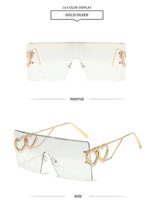 Detail view of rimless square sunglasses with gold metal temples and double heart design