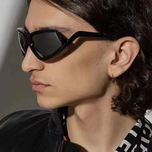 Side view of trendy cat-eye sunglasses with geometric black frame and futuristic design