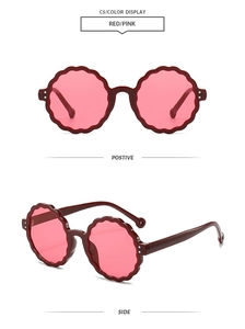 Detail of round scalloped flower sunglasses with burgundy frame and pink lenses