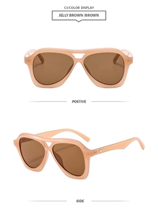 Detail view of jelly brown retro aviator sunglasses with dual beam frame and dark tea lenses