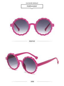 Detail view of round wavy edge sunglasses in purple with grey gradient lenses