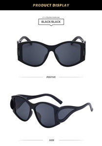 Detail view of oval punk sunglasses featuring unique hollowed-out frames in black