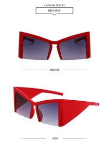 Detail of red futuristic cat-eye sunglasses showing front and side geometric frames