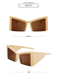 Detail view of bold beige cat-eye sunglasses with thick geometric frames and tea lenses
