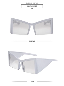 Detail view of silver geometric oversized cat eye sunglasses with metal frame and tinted lens