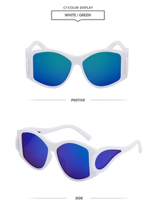 Detail view of white oval sunglasses featuring reflective green mirrored lenses and side shields