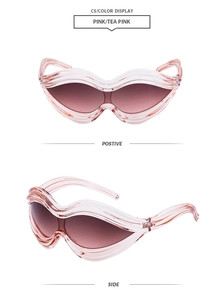 Detailed view of wave-shaped punk sunglasses in transparent pink with gradient tea lenses