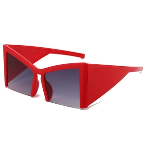 Fashionable oversized red cat-eye sunglasses with geometric frames and grey lenses