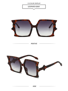 Detail view of leopard print star-accented sunglasses with gray gradient lenses