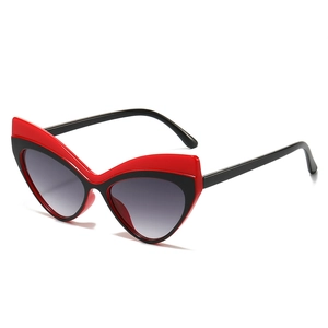 Lunettes de soleil œil de chat à monture bicolore rouge et noire et verres dégradés