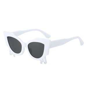 Chic white cat-eye sunglasses with unique teardrop rhinestones and dark lenses