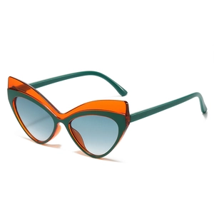 Lunettes de soleil œil-de-chat rétro avec monture orange contrastée et verres dégradés