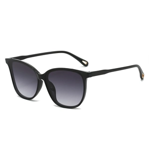 Trendy cat-eye sunglasses with gradient grey lenses and golden heart detail