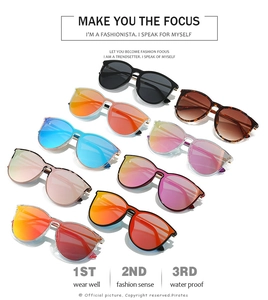 Collection of vibrant oversized sunglasses in various colors displayed in an array