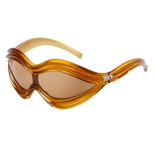 Trendy wave-shaped amber sunglasses with thick transparent frames in Y2K punk style