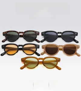 Detailed close-up of retro round frame sunglasses with rivet accents in multiple colors