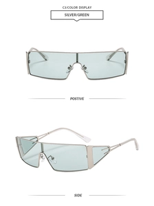 Détail des lunettes de soleil monture argentée avec verres verts et découpes latérales