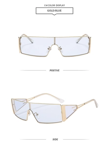 Vue détaillée des lunettes de soleil dorées oversize avec verres dégradés bleus et branches