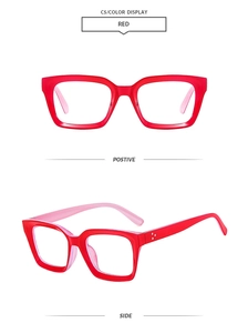 Detail of red square glasses frame with vintage three-point metal rivet accents