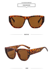 Detail view of tortoiseshell oversized sunglasses with brown lenses and wide temples