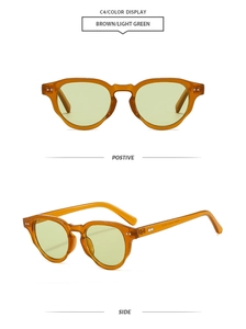 Detail view of round retro sunglasses with amber frame, green lenses and silver rivets