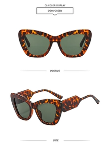 Details von Cat-Eye-Sonnenbrille mit Schildpatt-Muster, grünen Gläsern und breiten Bügeln