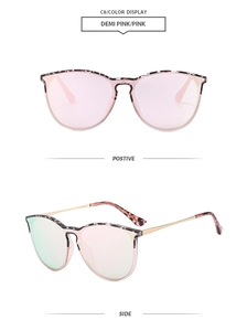 Close-up of demi pink aviator sunglasses with gradient lenses and gold metal temples